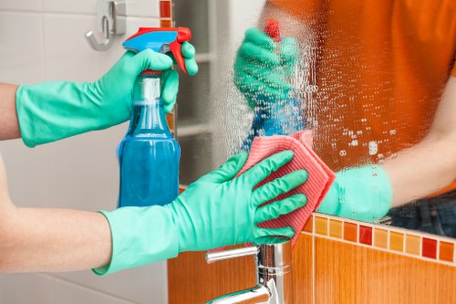 Cleaner preparing carpet cleaning equipment for a booked service