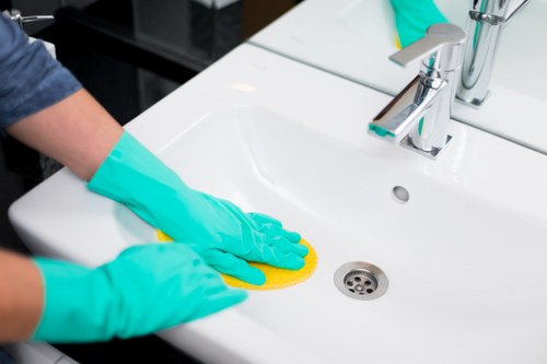 Removing a spill from a rug in Arnos Grove